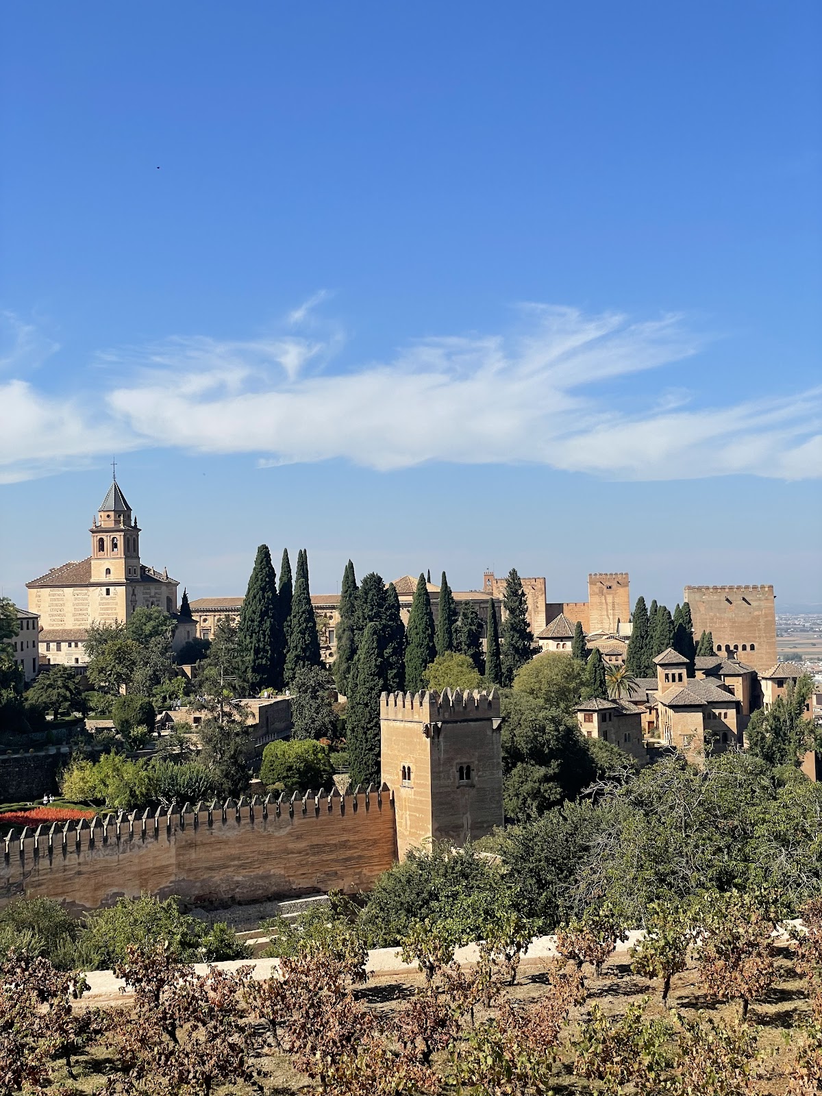 The Alhambra at sunset viewed from Mirador de San Nicolás — the iconic view every Granada travel guide points to