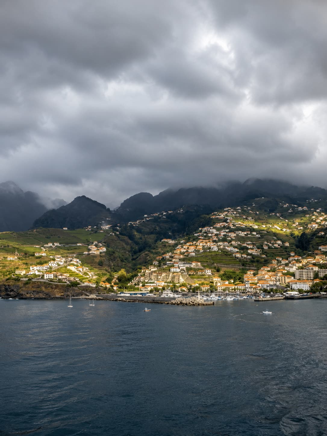 Grey marine-layer cloud over Funchal bay and the south coast of Madeira