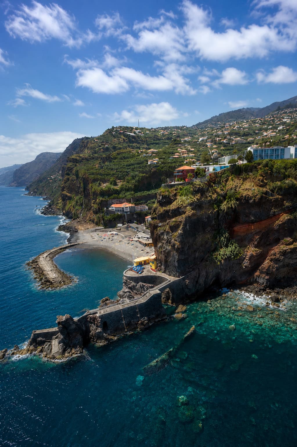 Clifftop terraces and a small beach on Madeira's sunnier southwest coast