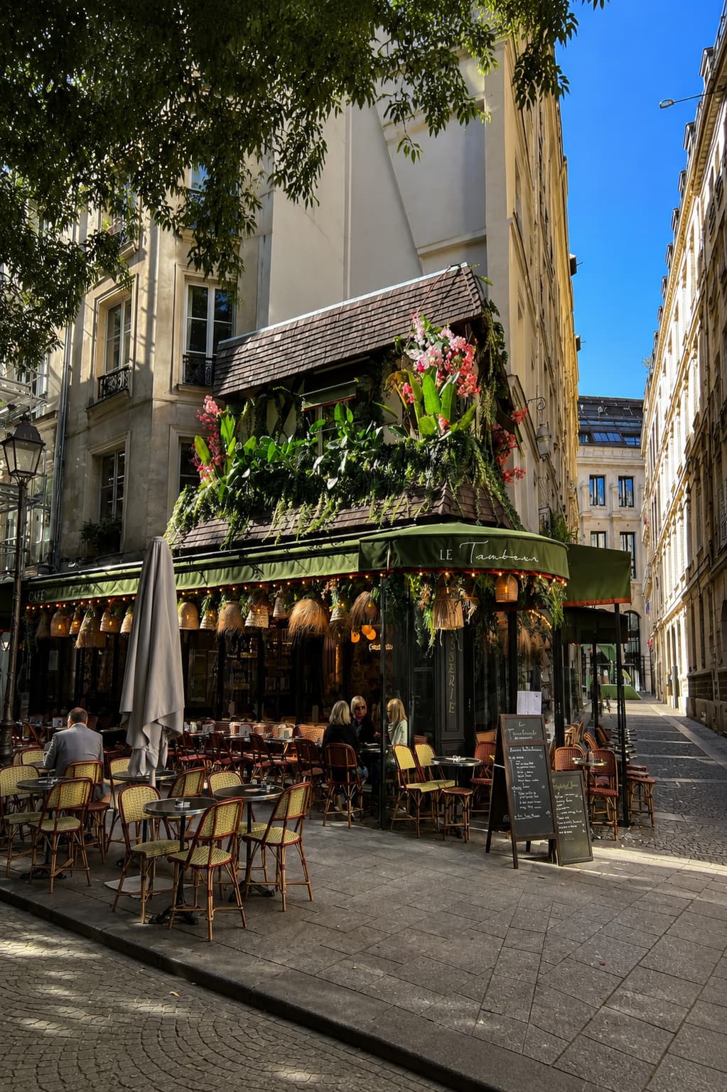 Best time to visit Paris in spring: a sunlit café terrace on a quiet Paris side street