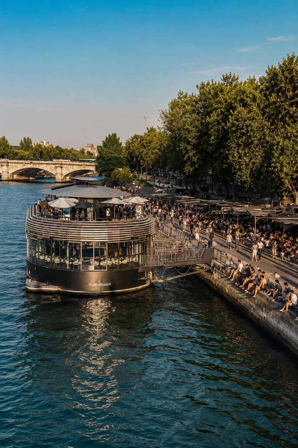 Best time to visit Paris in summer: crowds gather along the Seine at a floating riverside bar