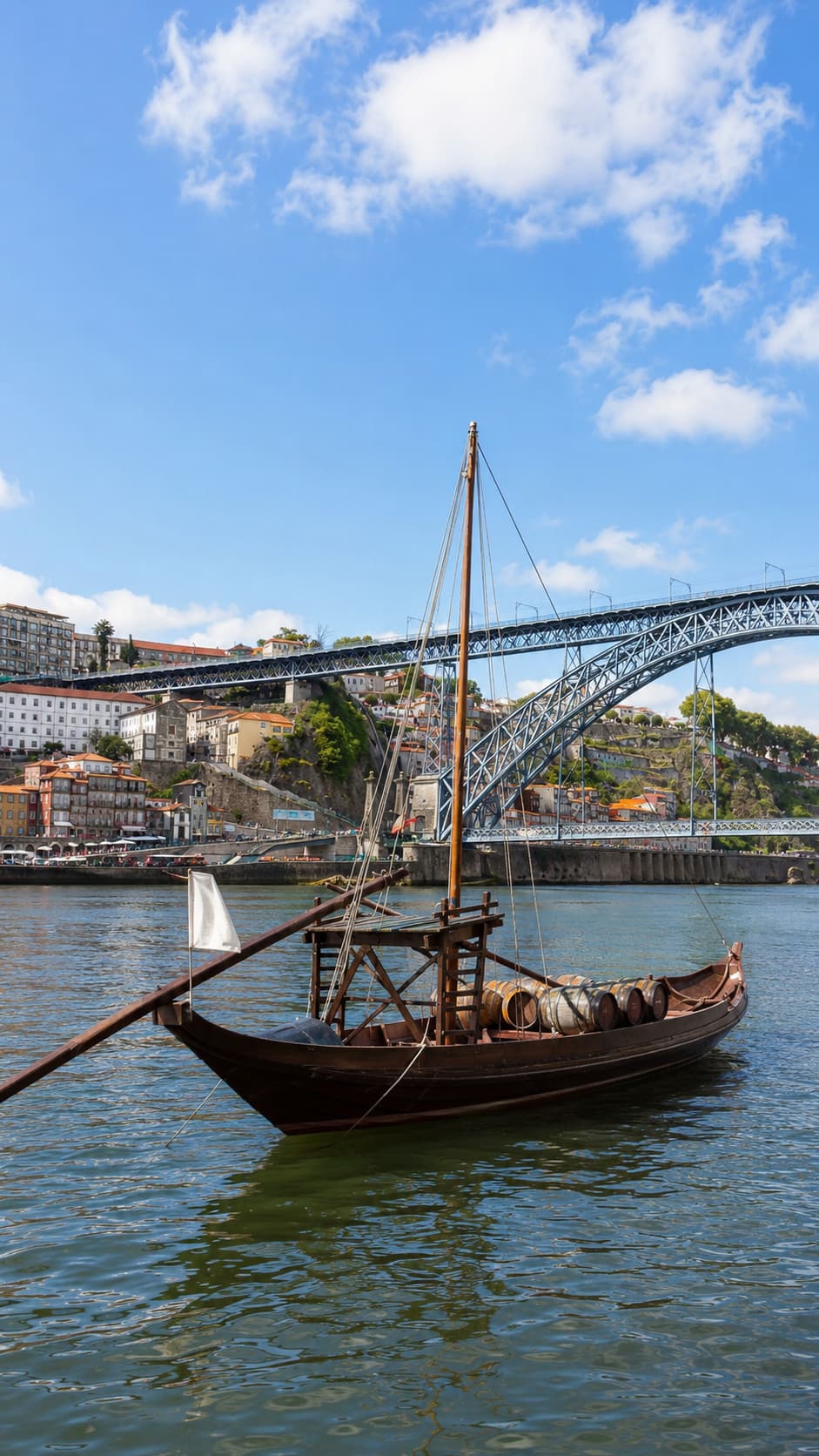 Traditional rabelo boat on the Douro below the Dom Luís I bridge, a highlight of any 3 days in Porto itinerary