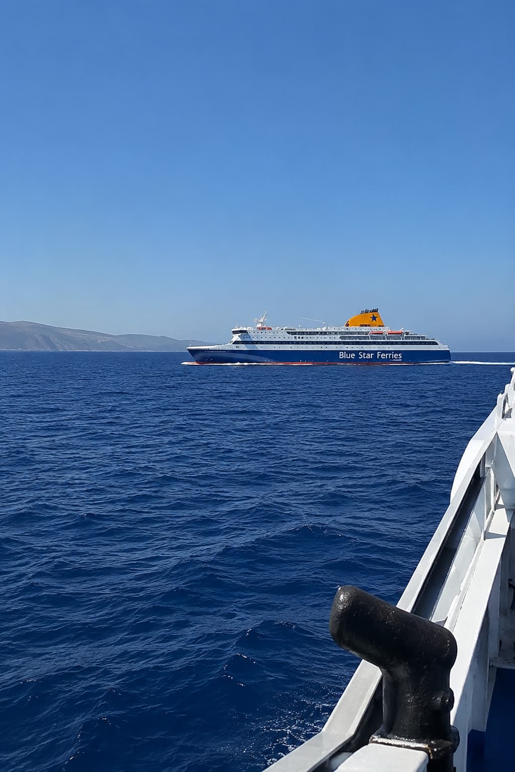 A high-speed Blue Star ferry crossing the Aegean between Santorini and Mykonos