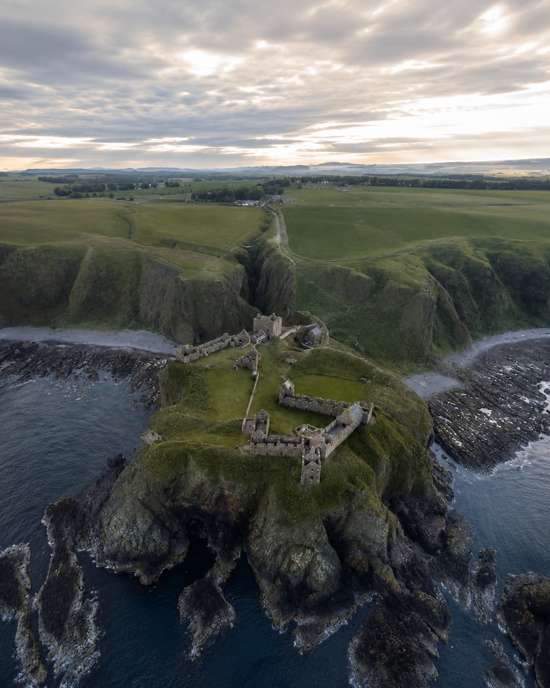 Dunnottar Castle aerial view on its sea stack above the North Sea — one of the best castles in Scotland