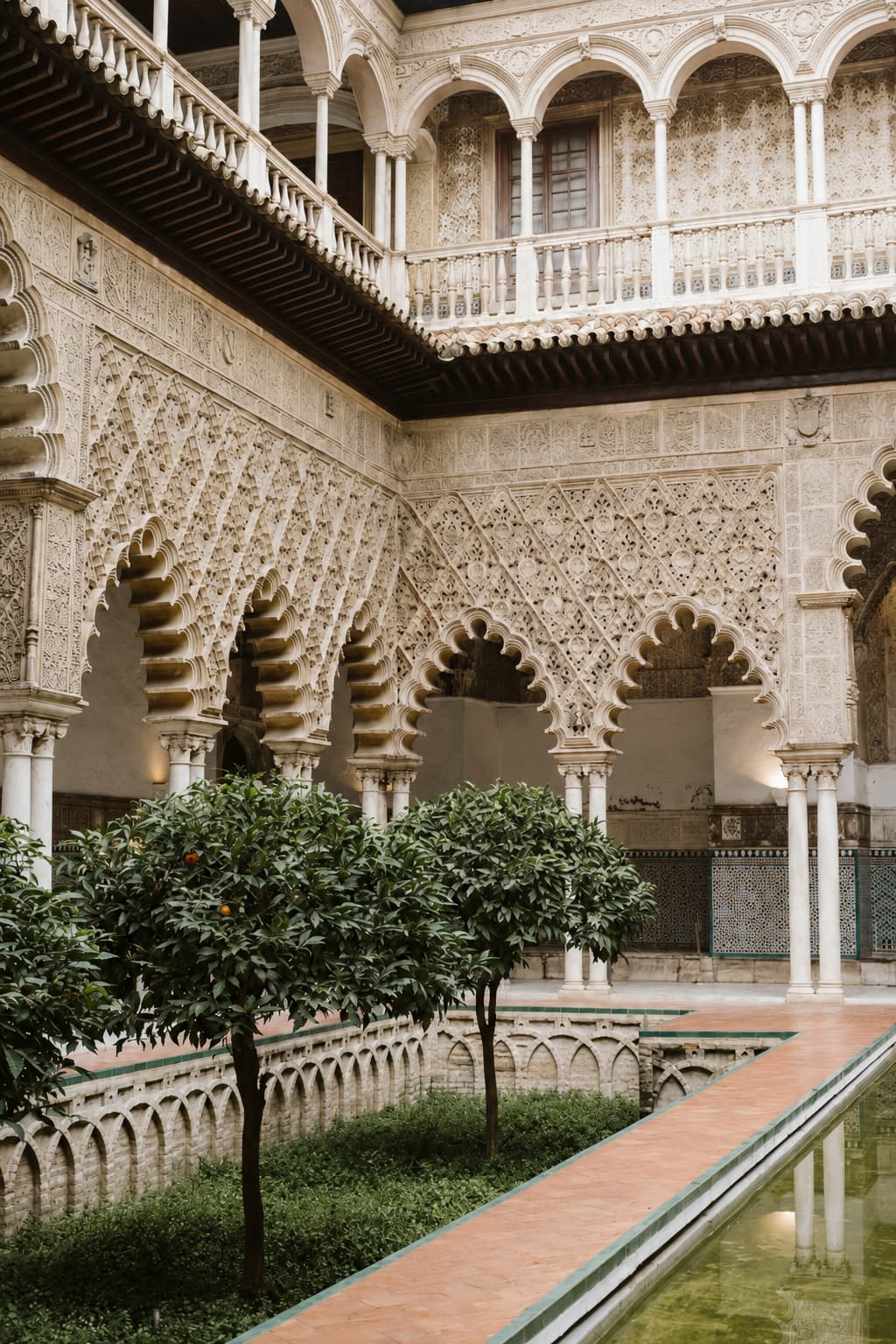 Seville Alcázar courtyard with orange trees in October, best European cities in October