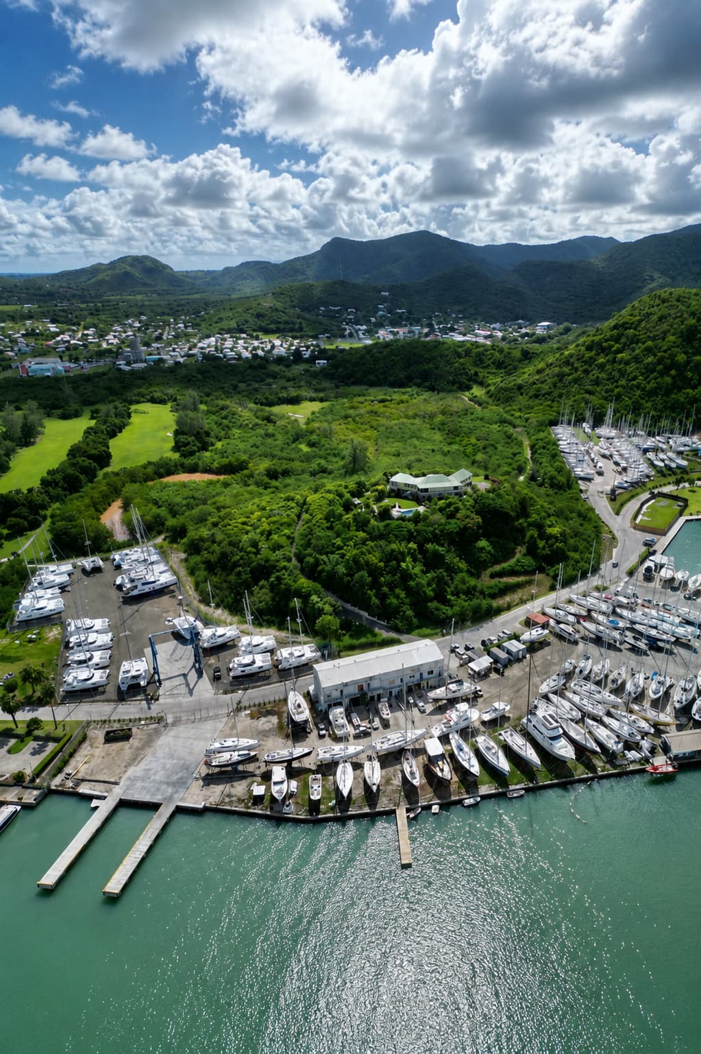 A packed high-end yacht marina in the Caribbean, the kind of pricey island that can leave most travellers priced out