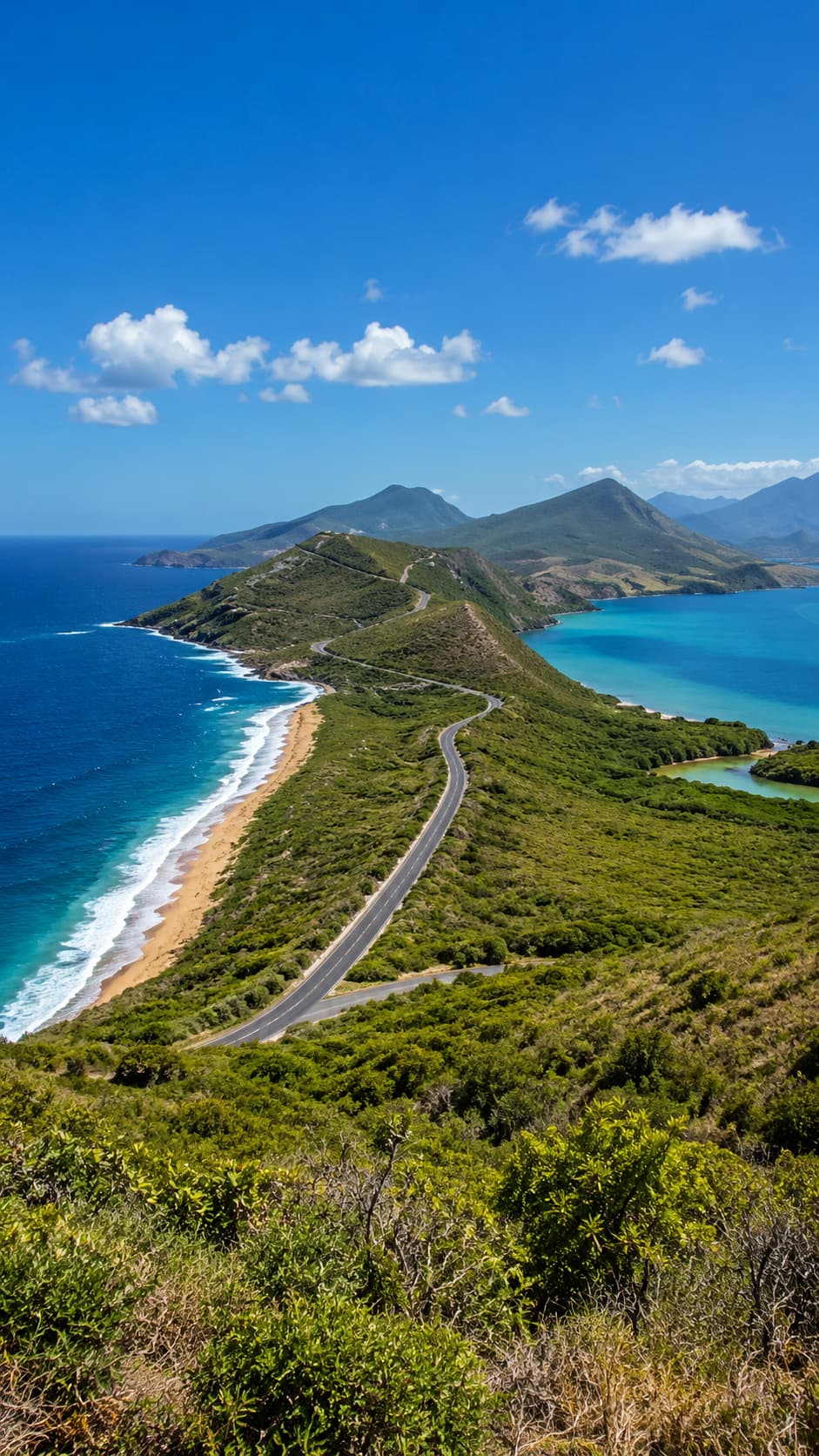 A winding coastal road along a green Caribbean peninsula with sea on both sides, showing an island easy to explore by car