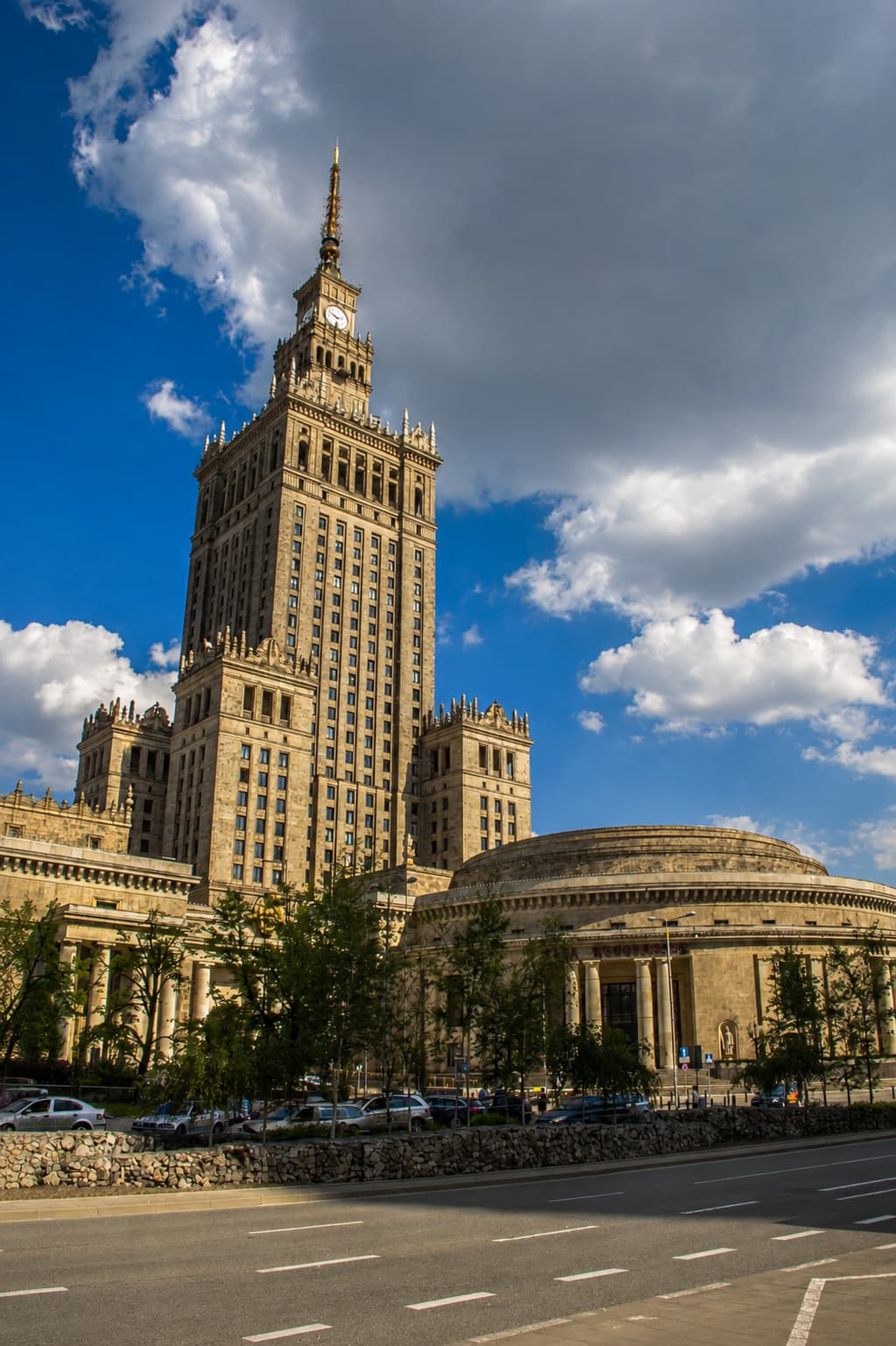 The Palace of Culture and Science in Warsaw, Poland, against a blue sky — eastern europe travel safety and modern city life