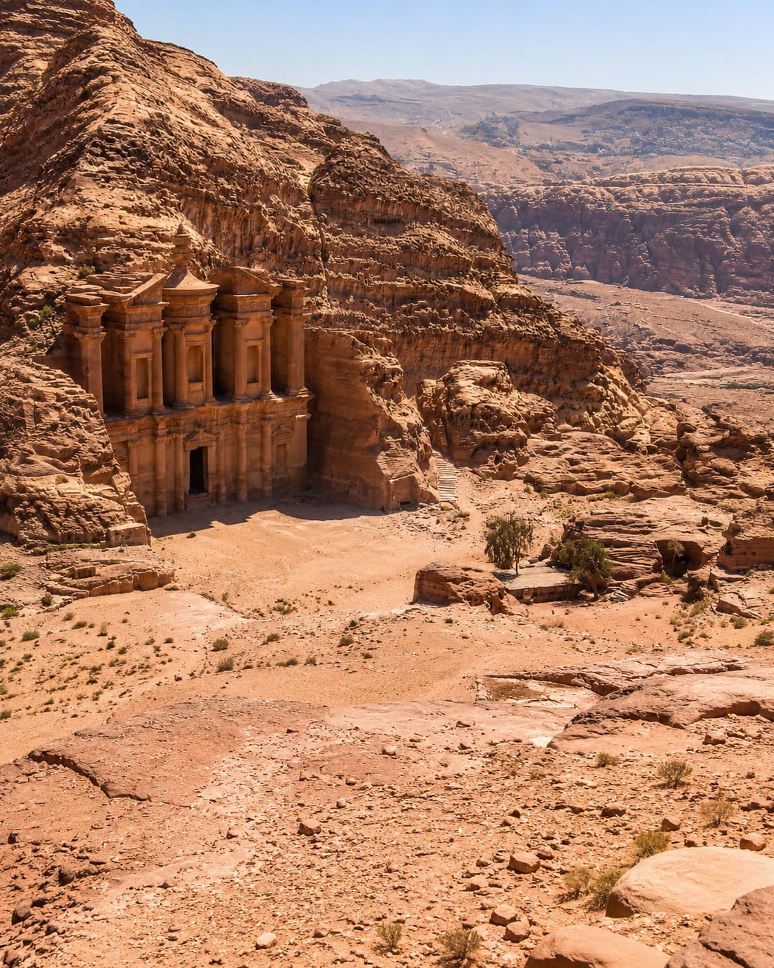 The Monastery (Ad Deir) at Petra seen from above with the valley stretching beyond