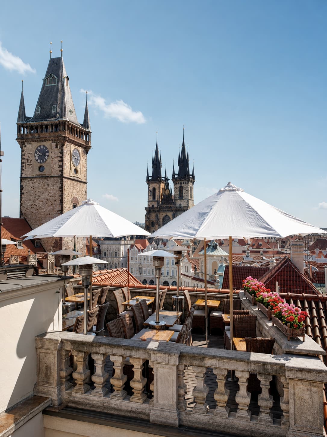 U Prince rooftop terrace Prague with astronomical clock tower and Týn Church spires — best cafe view of Old Town Square