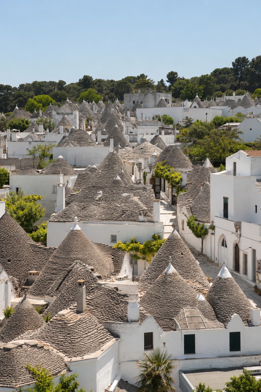 slow travel Italy base — trulli rooftops of Alberobello, Puglia, one of the best underrated southern regions for a month-long stay