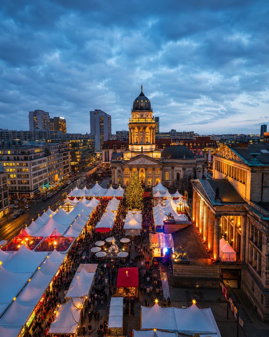 Berlin Gendarmenmarkt Christmas market aerial at blue hour, white tent stalls and lit Christmas tree, Französischer Dom dome behind