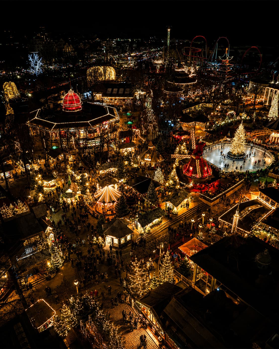 Copenhagen Tivoli Gardens Christmas market aerial view at night with ice rink and festive stalls — European Christmas market Denmark opening November 2026