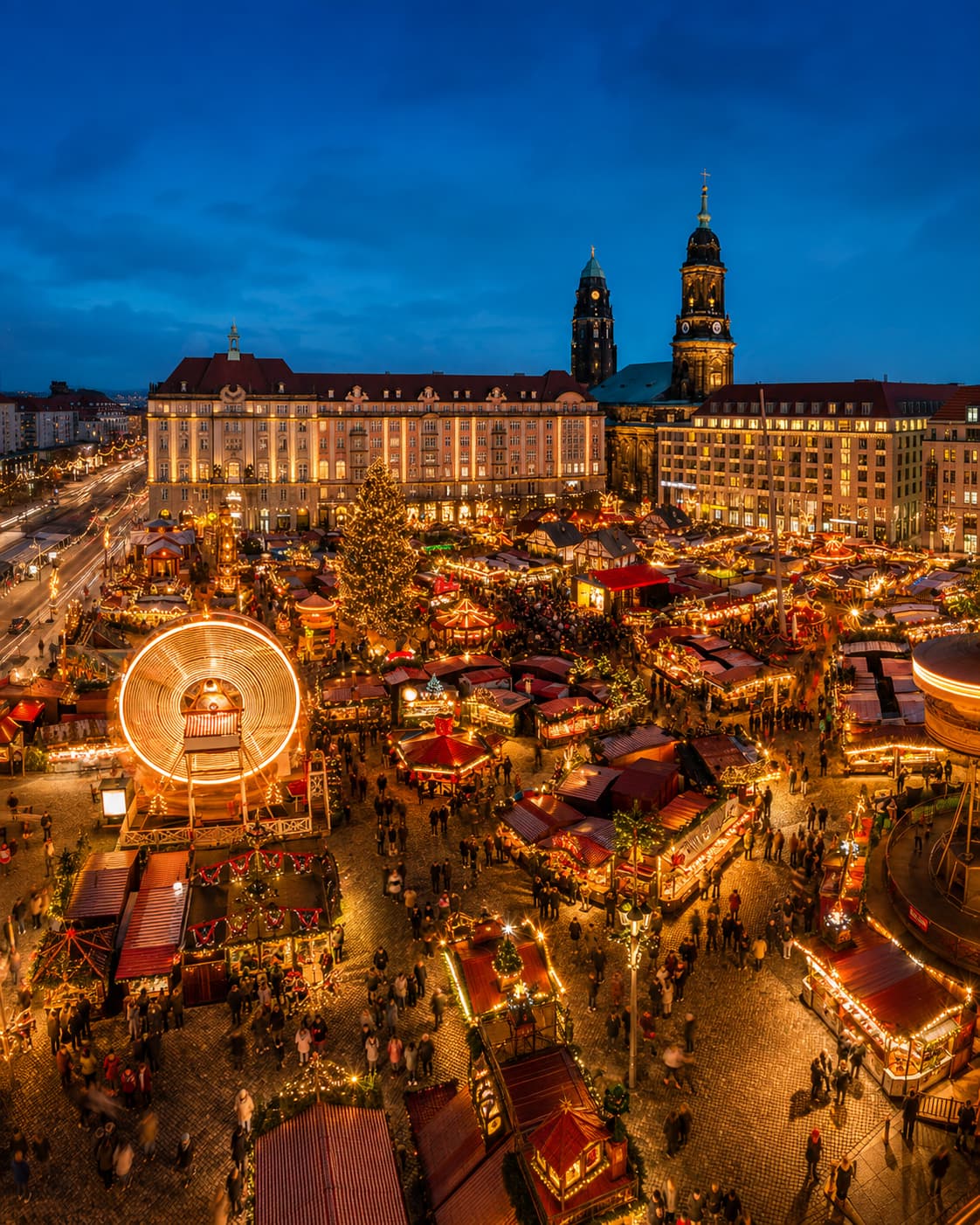 Dresden Striezelmarkt aerial view at night with ferris wheel and red-roofed stalls — one of the oldest Christmas markets in Europe opening 25 November 2026