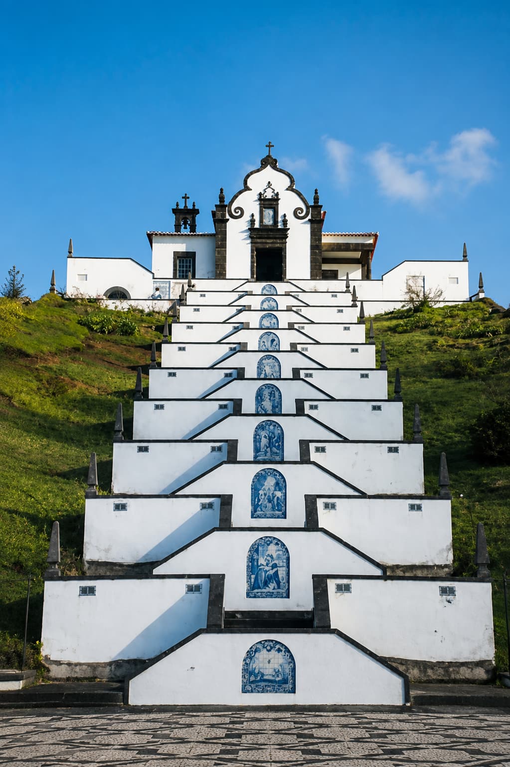 Nossa Senhora da Paz chapel staircase with blue azulejo tiles in the Azores São Miguel — unusual warm December travel destination