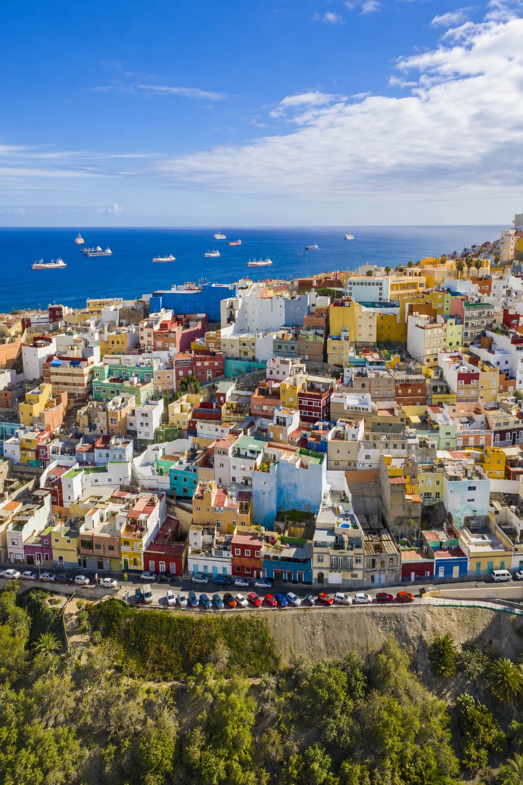 Las Palmas de Gran Canaria colorful hillside neighbourhood with Atlantic Ocean in background — warm place to go in December