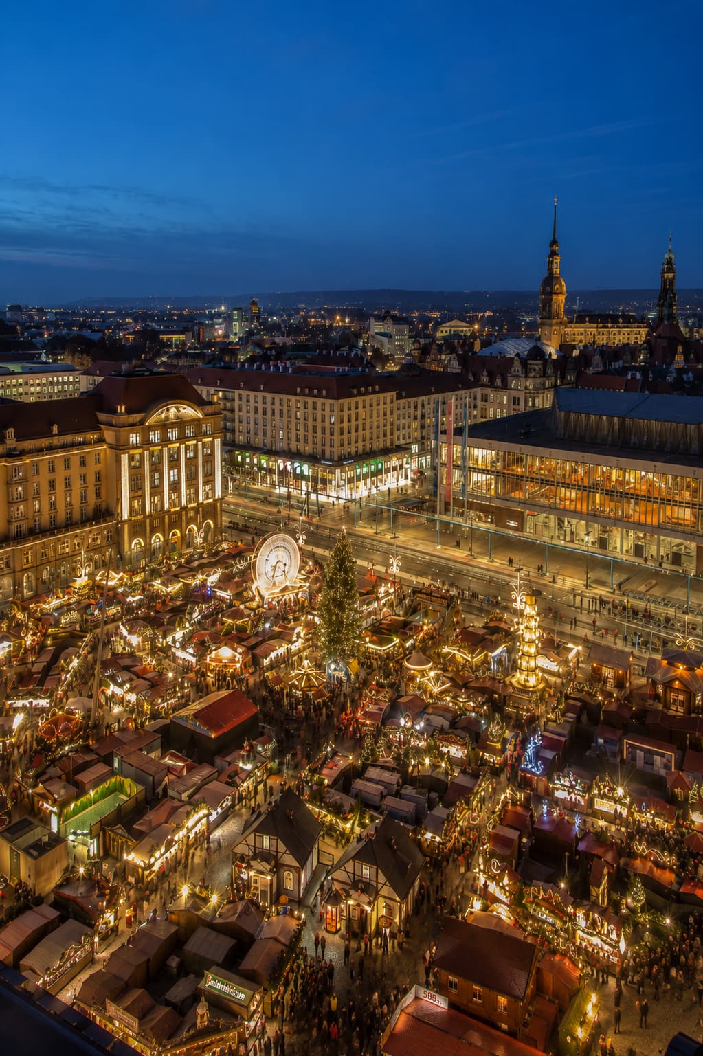 germany christmas markets — Dresden Striezelmarkt at night, the world's oldest Christmas market spread across Altmarkt square