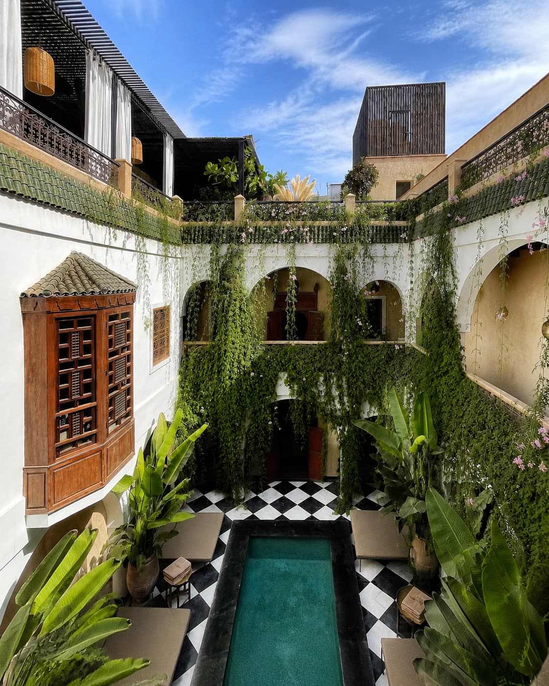 Marrakech riad courtyard with pool and trailing plants — Morocco weather by month in spring and autumn makes riad stays ideal