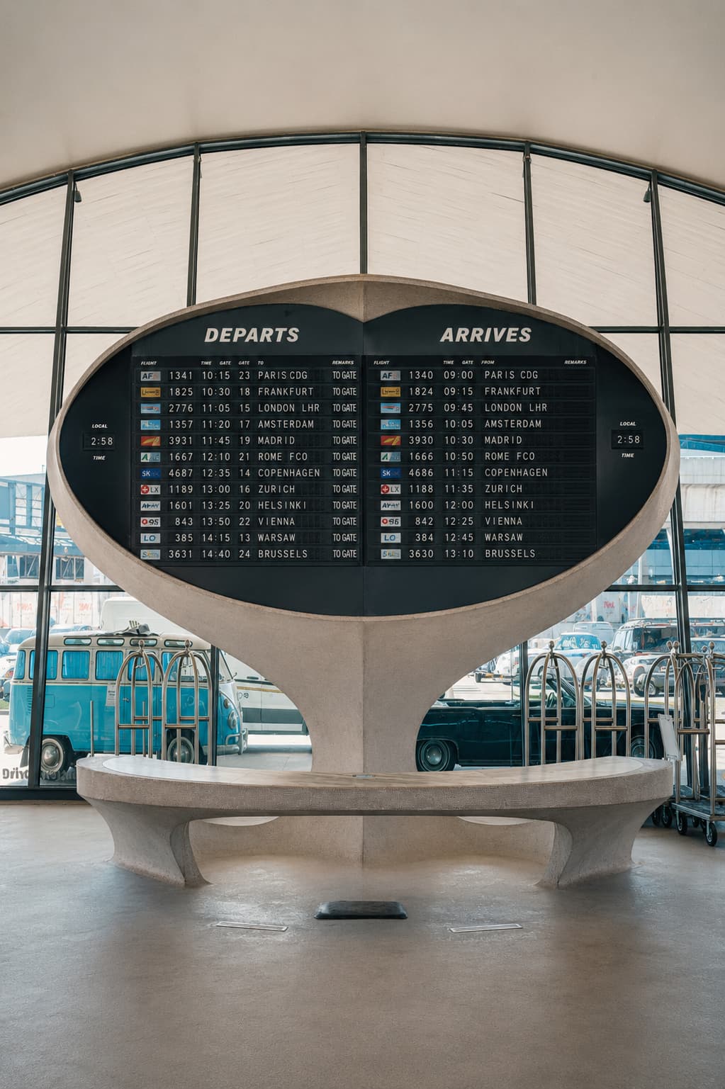 Vintage airport departure board showing international flights to Paris, Frankfurt, London and Amsterdam — the destinations available for Thanksgiving travel abroad