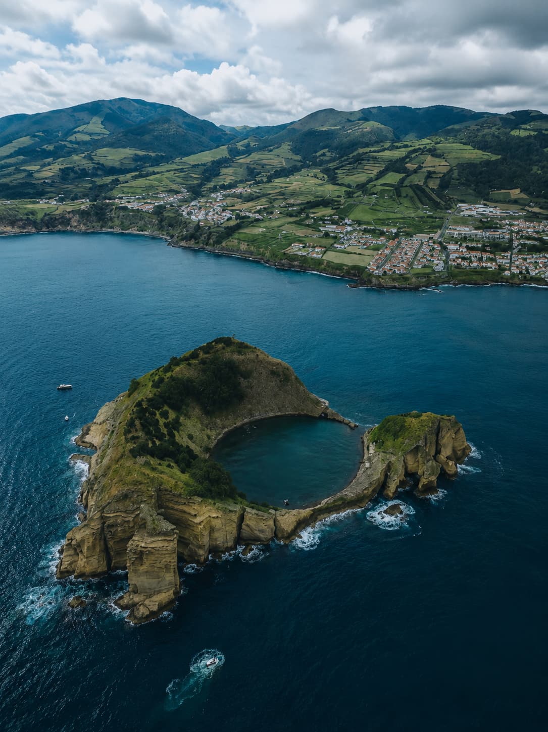 Aerial view of Vila Franca do Campo volcanic islet in the Azores with a circular crater lake — the Azores are an accessible Thanksgiving travel abroad option from Boston and New York